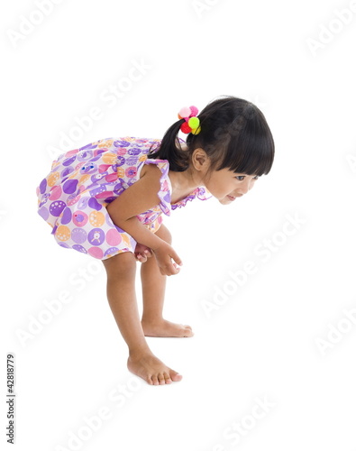 cute girl sees something on the floor