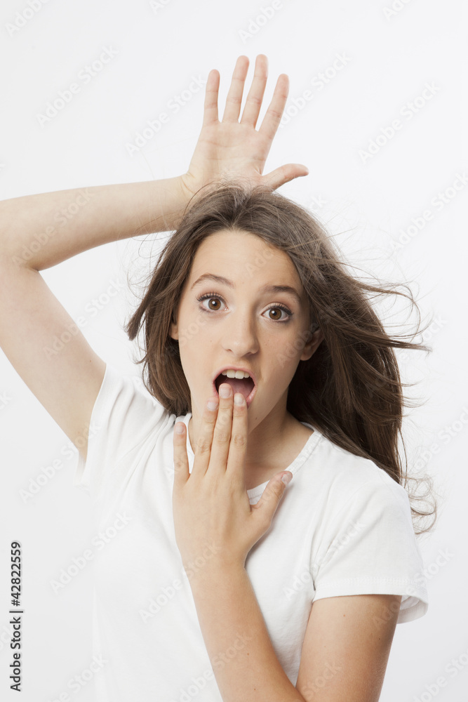 funny expression and gesture of a real young girl