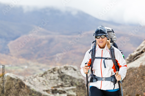 Woman trekking in mountains, Nepal
