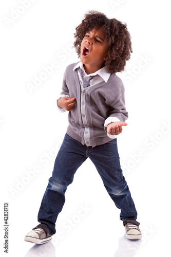 Little african american boy playing air guitar