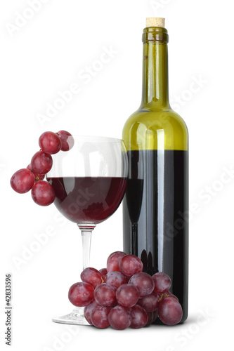 Red wine bottle and young grape on white
