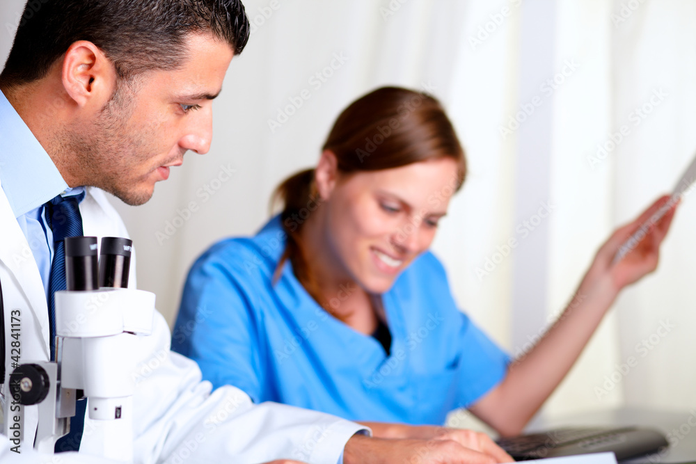Two medical scientific working at laboratory Two medical scientific working at laboratory