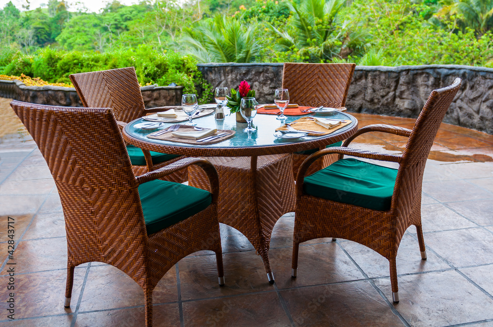 Fancy tables set for a dinner on the terrace