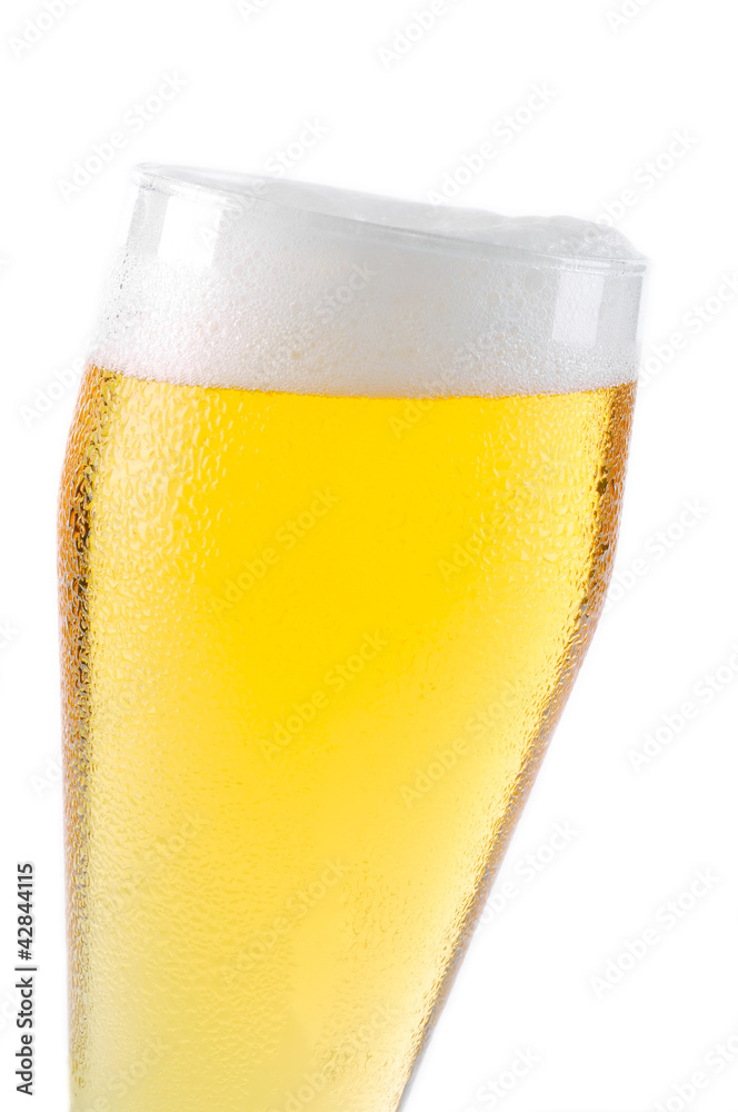 Beer into glass isolated on white Beer into glass isolated on white