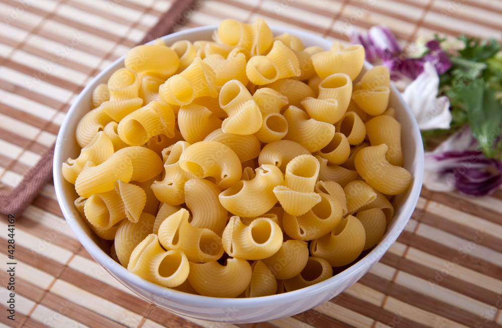 Uncooking italian pasta in bowl