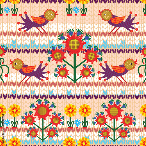 Knitted seamless with birds and floral elements.