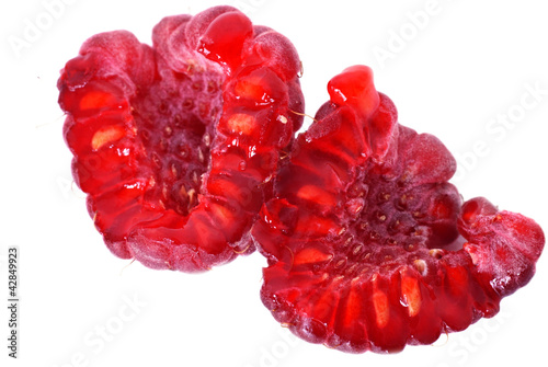 two halves of ripe red raspberry