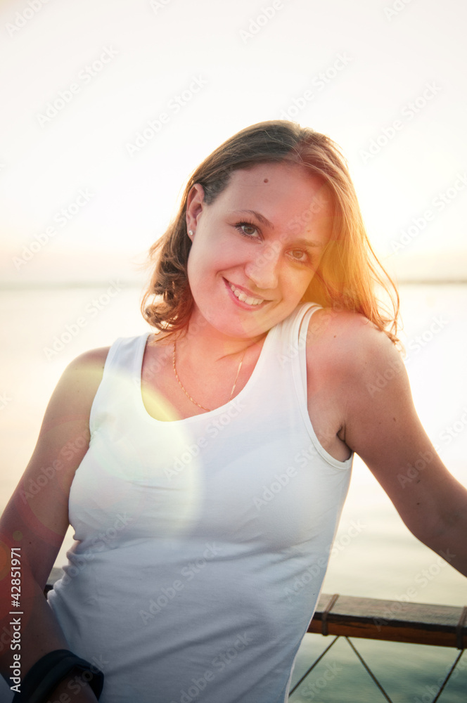 woman enjoying summer breeze at sunset beach woman enjoying summer breeze at sunset beach