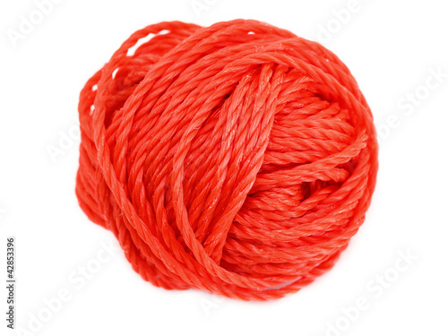 Red ball of yarn isolated on a white