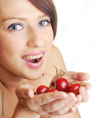 Beautiful brunette with cherry fruit on white background