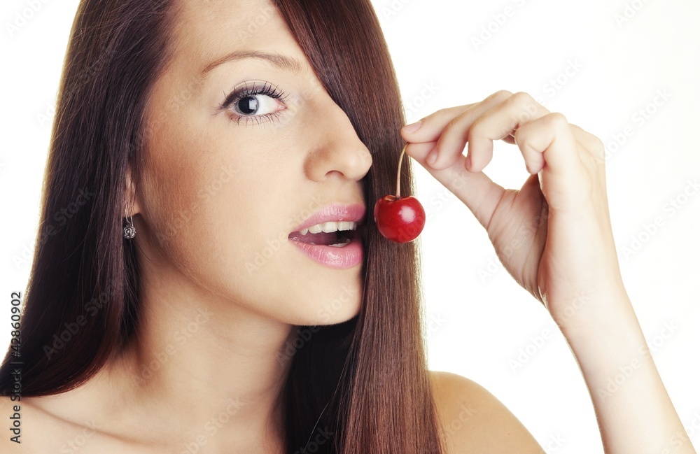 Beautiful brunette with cherry fruit on white background Beautiful brunette with cherry fruit on white background