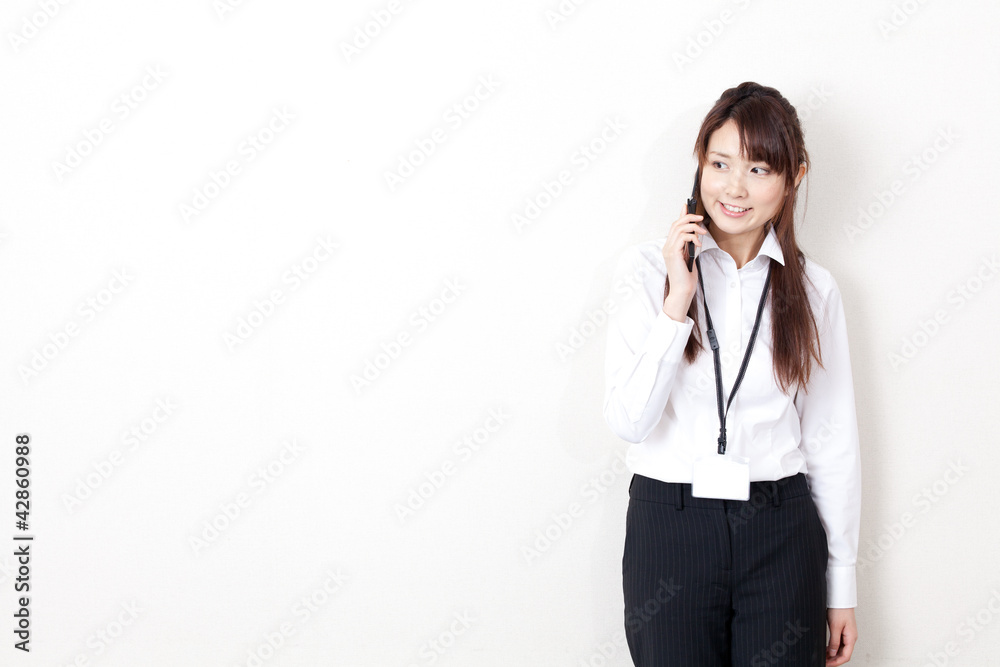 asian businesswoman talking by cellphone asian businesswoman talking by cellphone