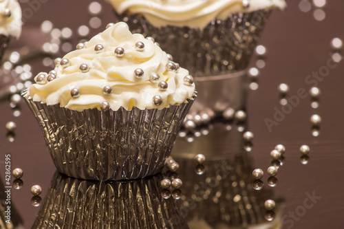 White Cupcakes with Silver Decoration