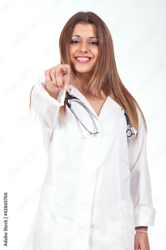 female doctor standing with a stethoscope on the neck and pointi female doctor standing with a stethoscope on the neck and pointi