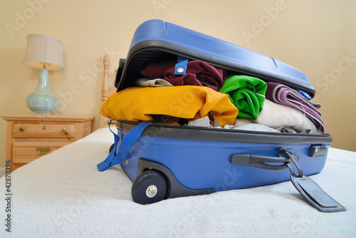luggage on a bed photo
