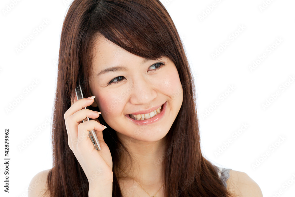 Beautiful young woman using a mobile phone Beautiful young woman using a mobile phone
