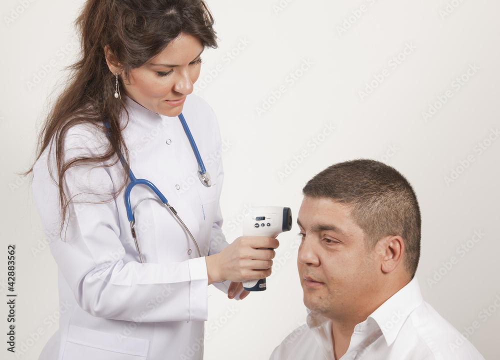 Photo of female doctor checking patient heat fever in hospital Photo of female doctor checking patient heat fever in hospital