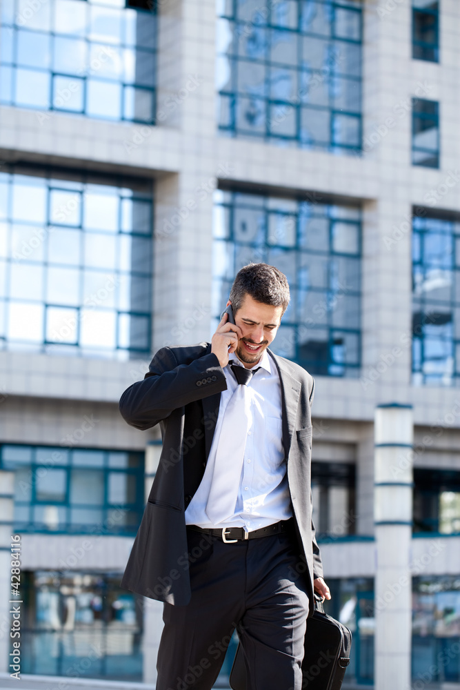 Attractive Young Businessman On Cellphone