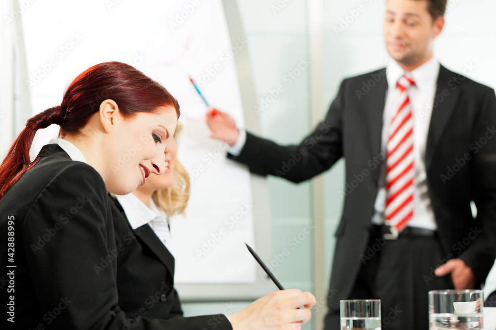 Business people - presentation within a team Business people - presentation within a team