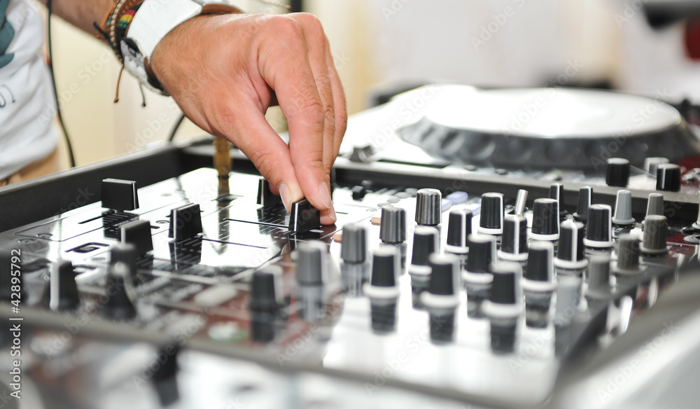 Working Disc jockey at party. Detail of a dj hands. Working Disc jockey at party. Detail of a dj hands.