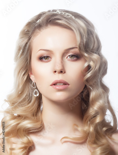 Beautiful blonde girl on white background close-up portrait