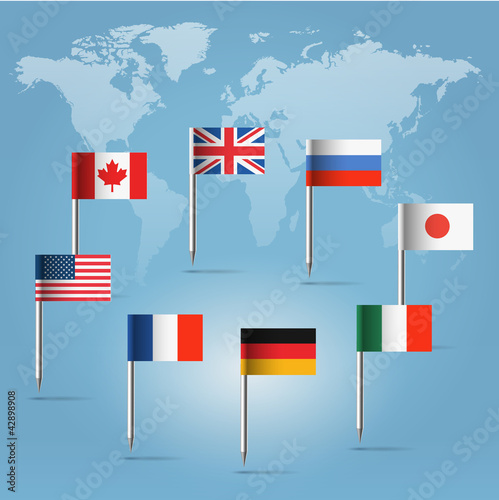 G8  flag pins over world map silhouette