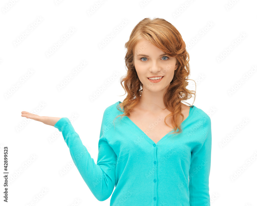 girl showing something on the palm of her hand girl showing something on the palm of her hand