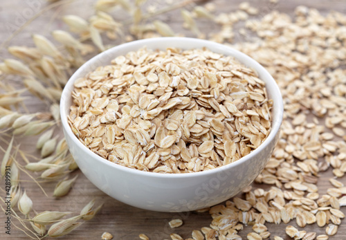 Bowl of oat flakes photo