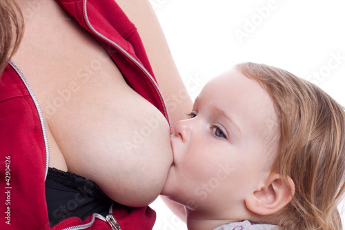 Little girl eating milk