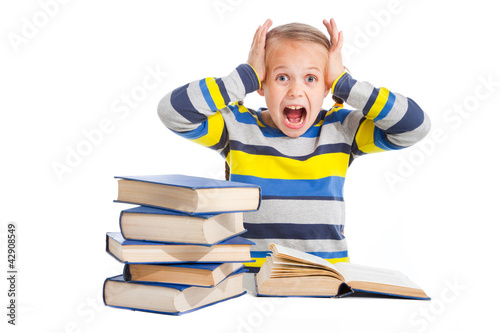 schoolgirl with horror looking at pile of books
