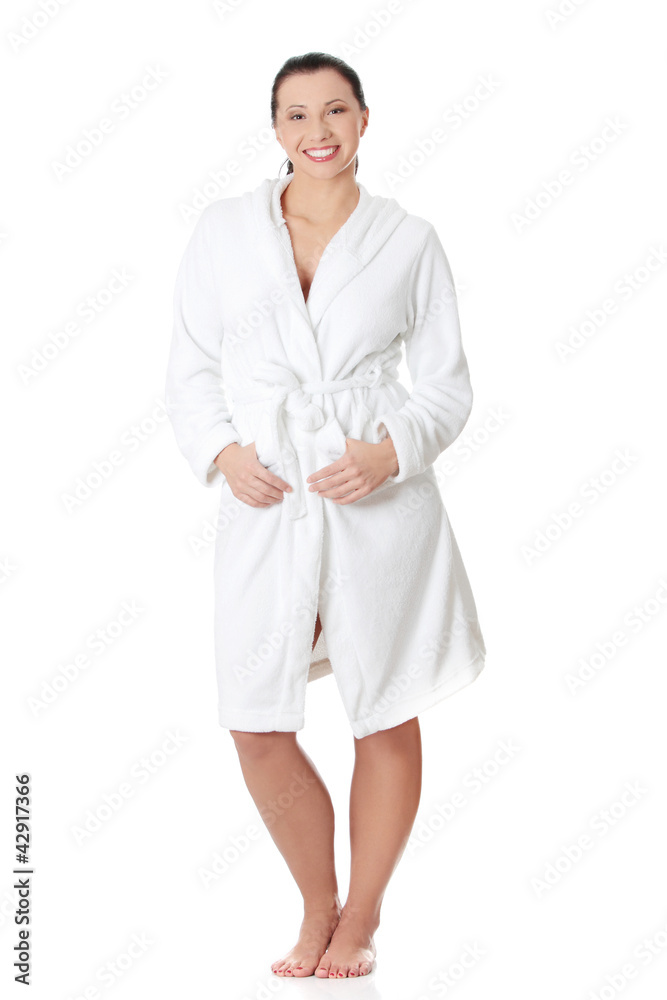 Beautiful woman standing wearing bathrobe. Beautiful woman standing wearing bathrobe.