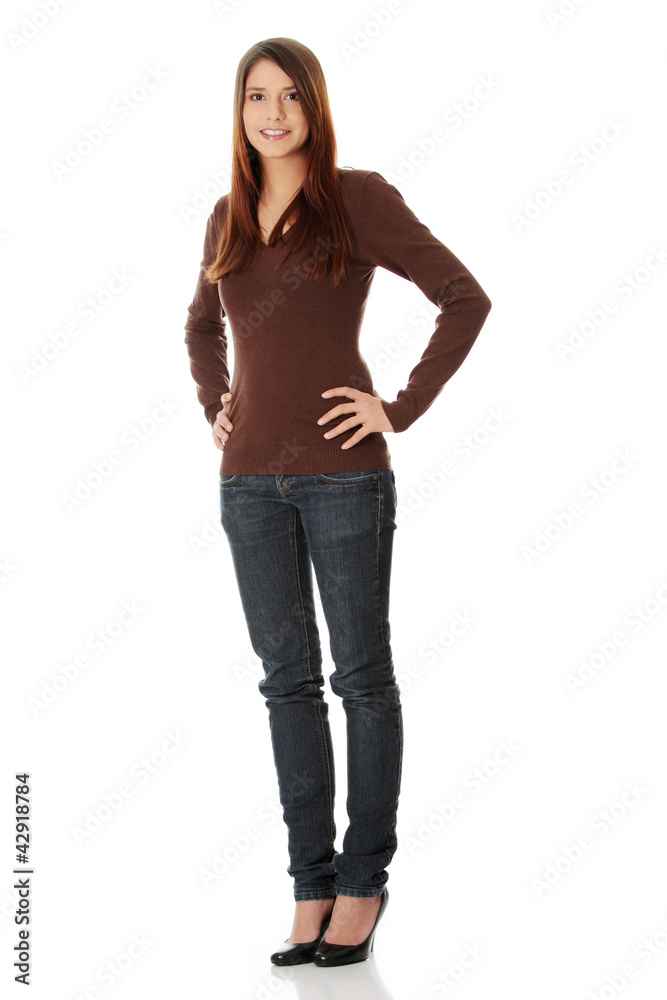 Young beautiful woman is looking straight and smiling. Young beautiful woman is looking straight and smiling.