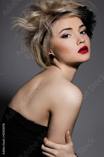 beautiful fashionable woman with black flower
