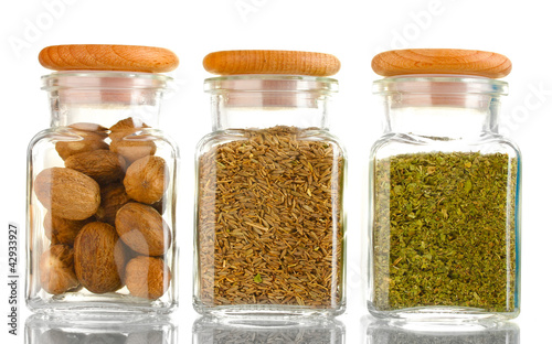 powder spices in glass jars  isolated on white