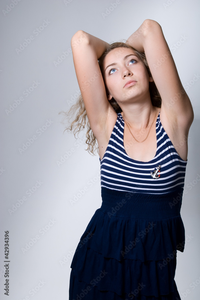 Beautiful girl with the lifted elbows looks upward Beautiful girl with the lifted elbows looks upward