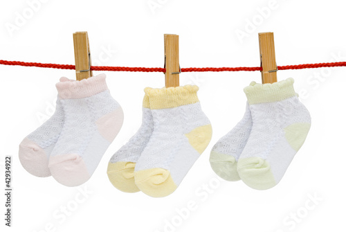 three pairs baby socks hanging with clipping path