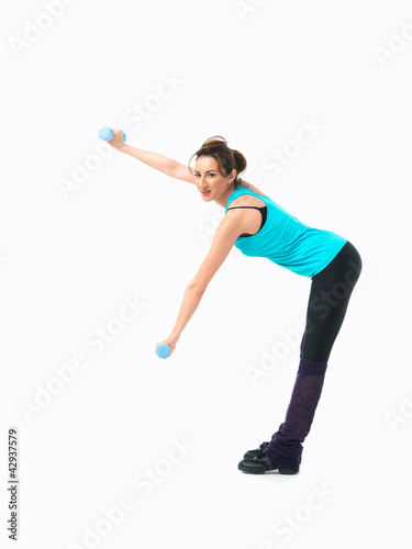 young woman showing fitness routine, white background
