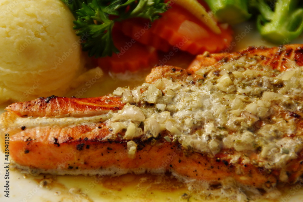 Grilled Salmon Steak Served with Lemon Sauce
