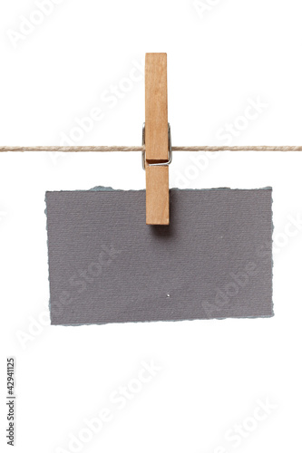 clothes peg and note paper on clothes line rope