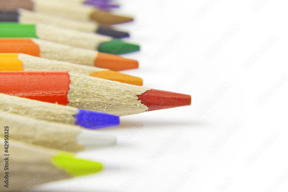 Colorful pencils crayons on white background closeup Colorful pencils crayons on white background closeup