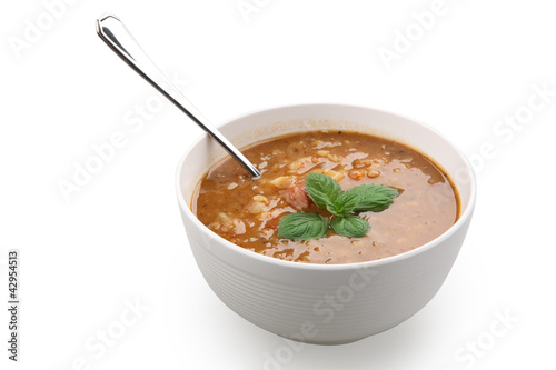 lentil soup in white bowl isolated with clipping path