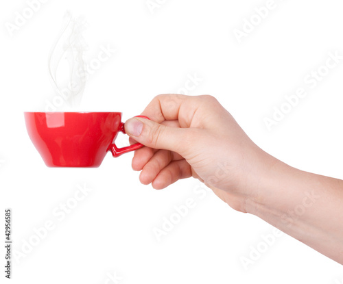 Fotografie Red cup of tea or coffee in hand