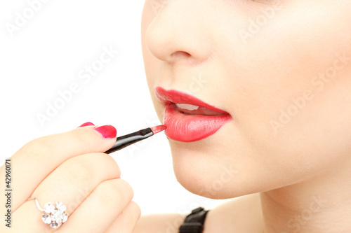 beautiful woman applying li...