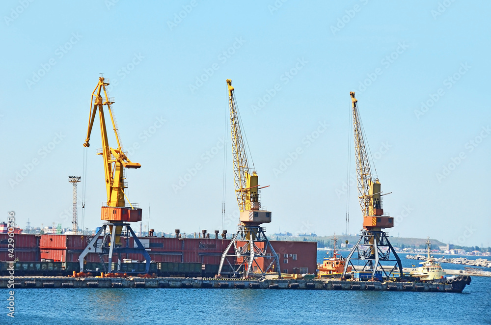 Tugboat under crane bridge in port of Odessa, Ukraine