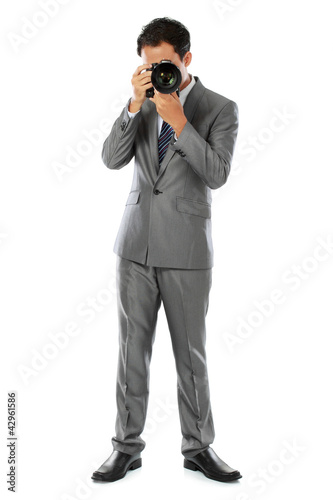 photographer using dslr camera © Odua Images