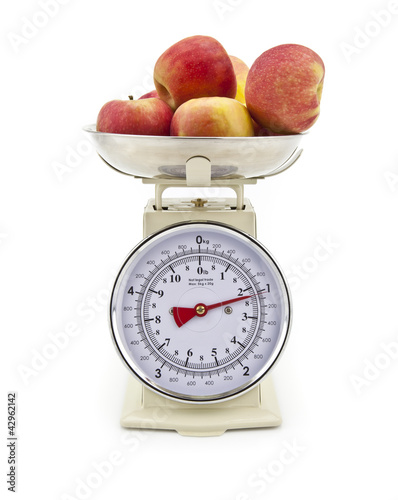 Old style kitchen scales with Apples on white background Isolate photo