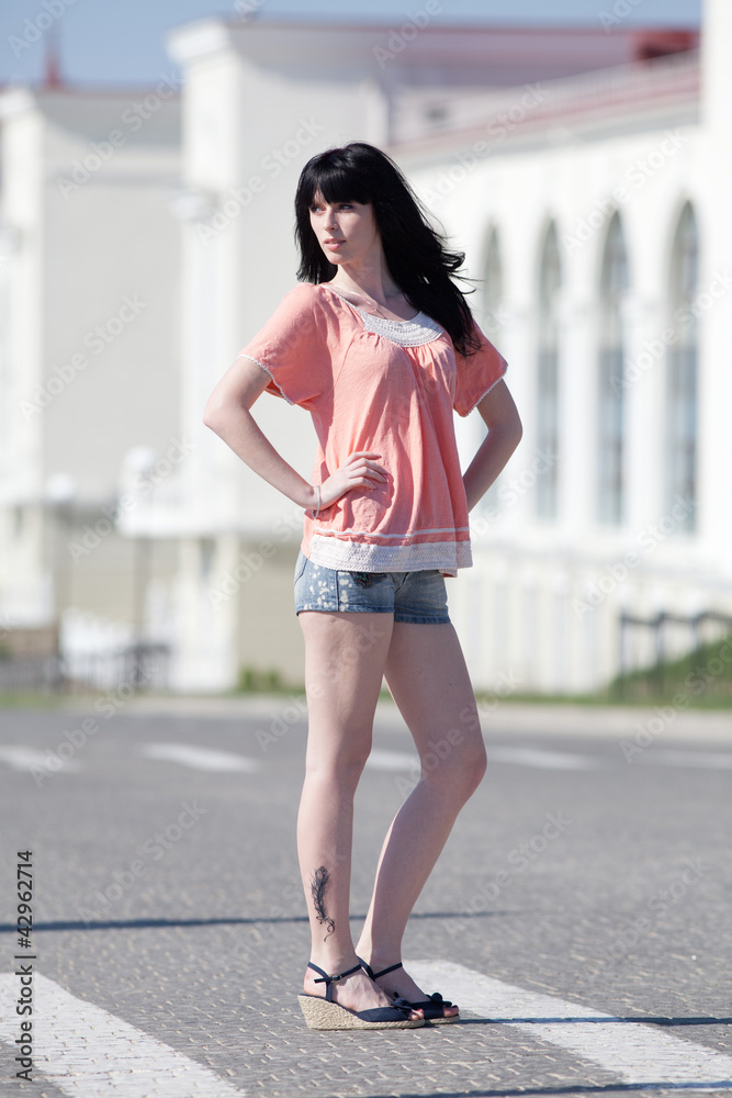 Brunette in the middle of crosswalk