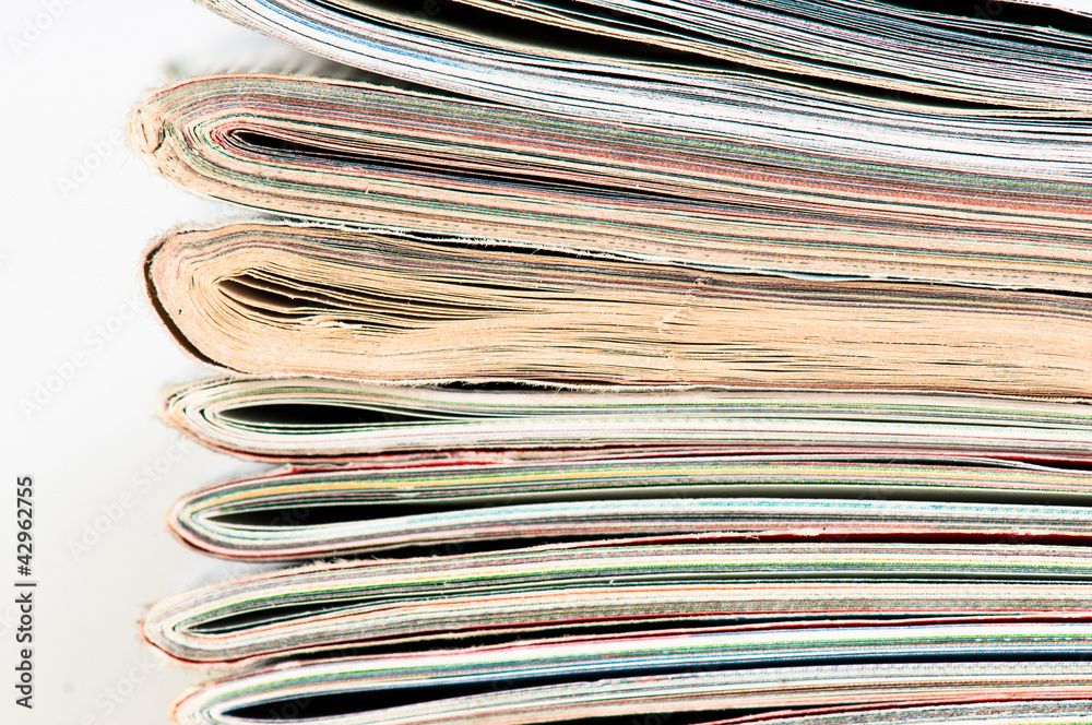 A large stack of magazines piled high. A large stack of magazines piled high.