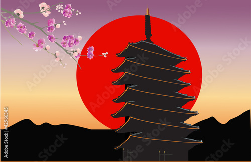 pagoda and pink floral branch at sunset