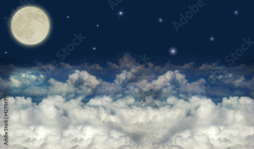 full moon above dark clouds